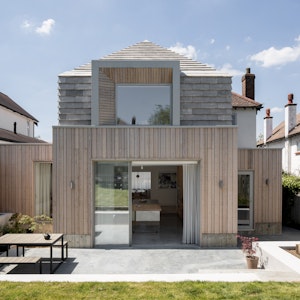 Hipped House's Confidence Through the Stepped Roof by Oliver Leech Architects