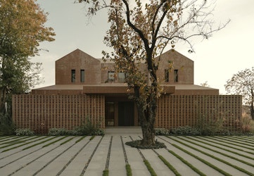 Redesign Anna Garden House, KiKi ARCHi Shows Simplicity That Remains Elegant In Red Brick