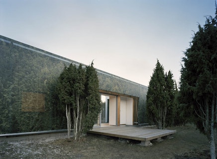 Juniper House: Wooden Cottage behind Fabric Layer